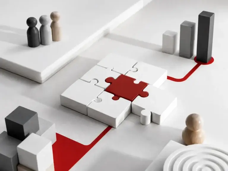 Conceptual business strategy scene with puzzle pieces, growth blocks and a red pathway